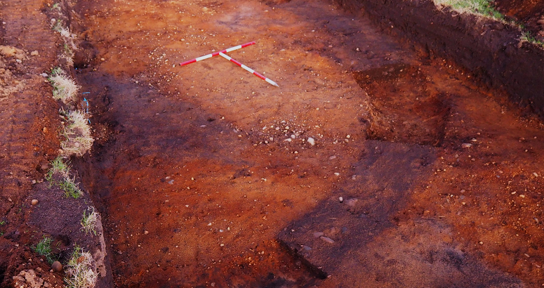 Barrow during excavation showing the central grave