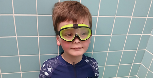 Young Learn to Swim student Andrew Caie wearing goggles head shot 